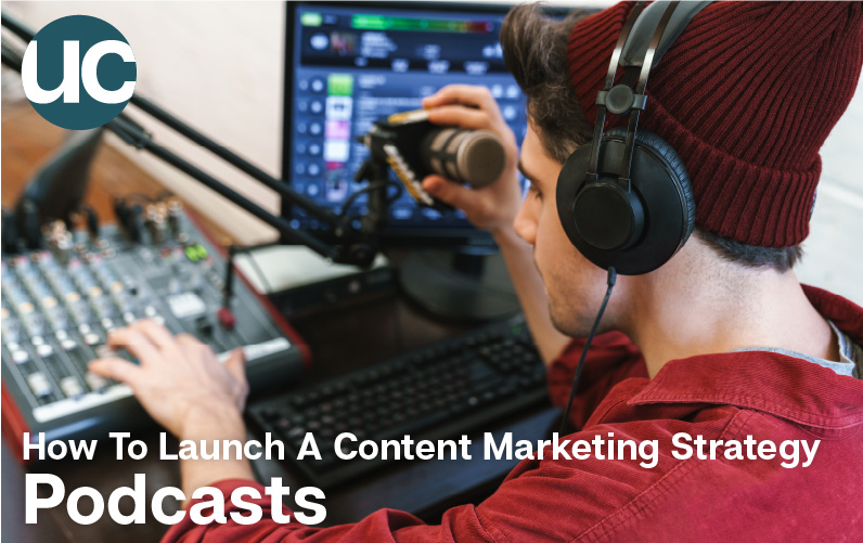 How To Launch A Content Marketing Strategy - Podcasts: Featured image - A man wears a red toque and hoodie with over hear headphones over top and adjusts a microphone and mixer that are recording onto his computer