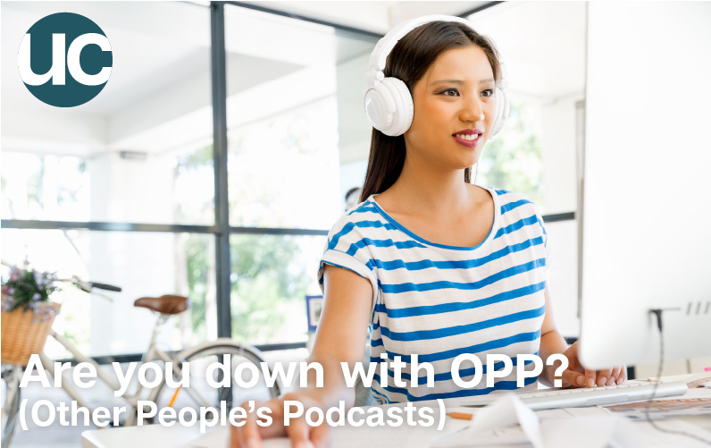 Are you down with OPP Other People’s Podcasts - Featured Image: A woman sits at her desk in a bright room with a lot of windows, she wears white headphones and is browsing on her computer